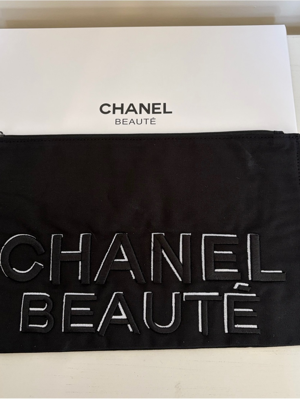 Authentic CHANEL Black Cosmetic Pouch with White Embroidered Logo & Box